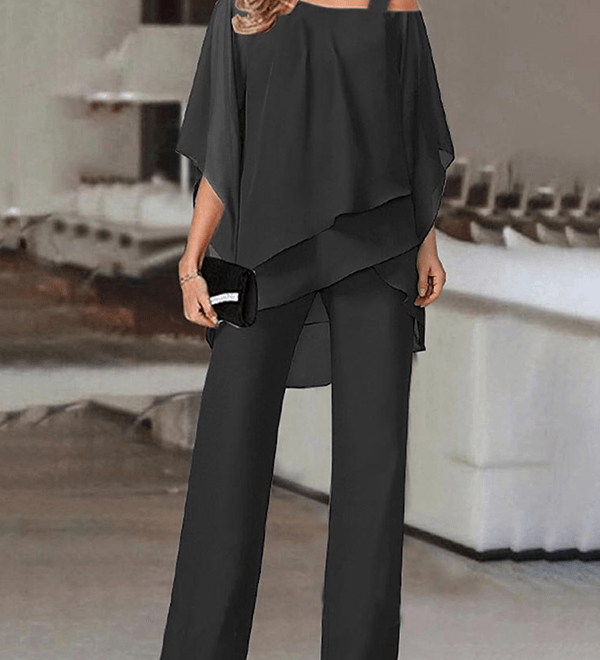Elegant to-delt buksedragt med asymmetrisk chiffon-top