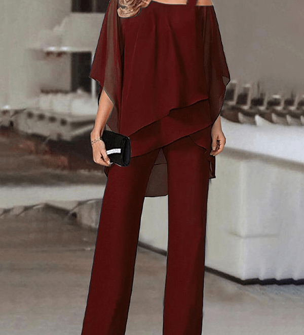 Elegant to-delt buksedragt med asymmetrisk chiffon-top